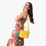 Canary Small | Model wearing a petite tote purse with structured leather handles and crossbody strap