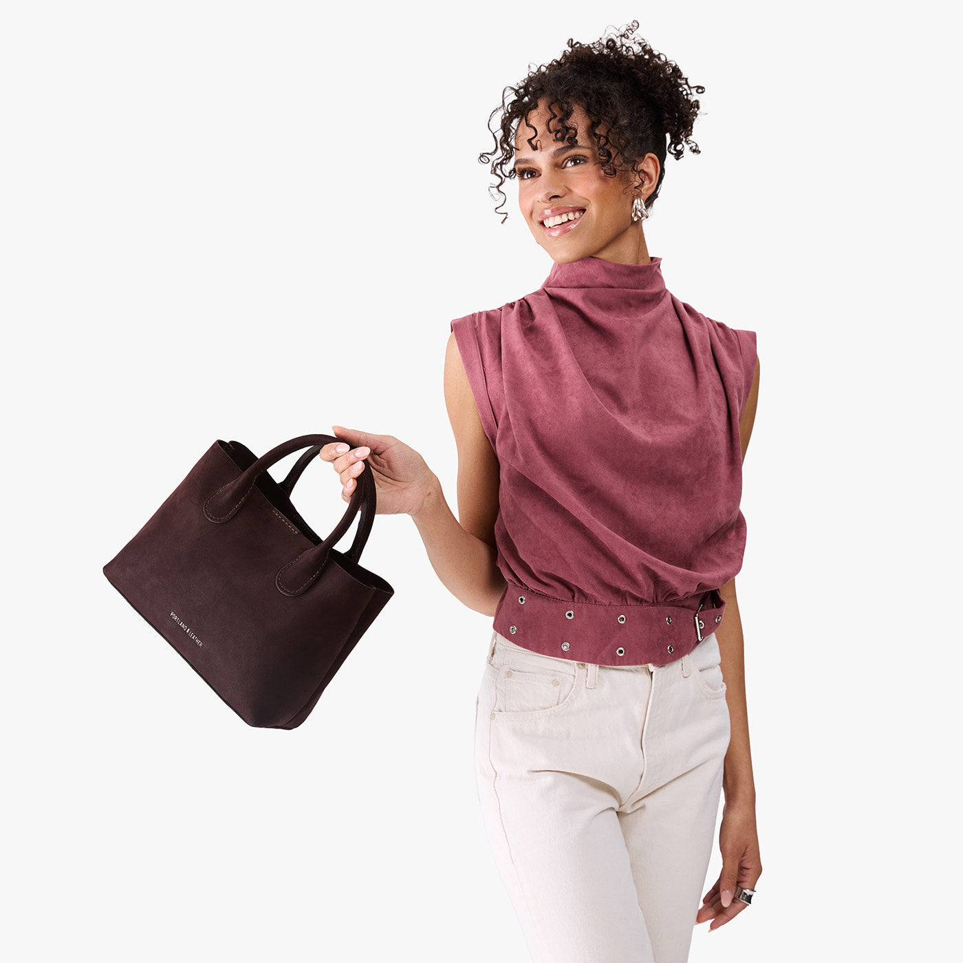 Velvet Brown*Large | Model holding mid-size tote purse with  structured leather handles and crossbody strap