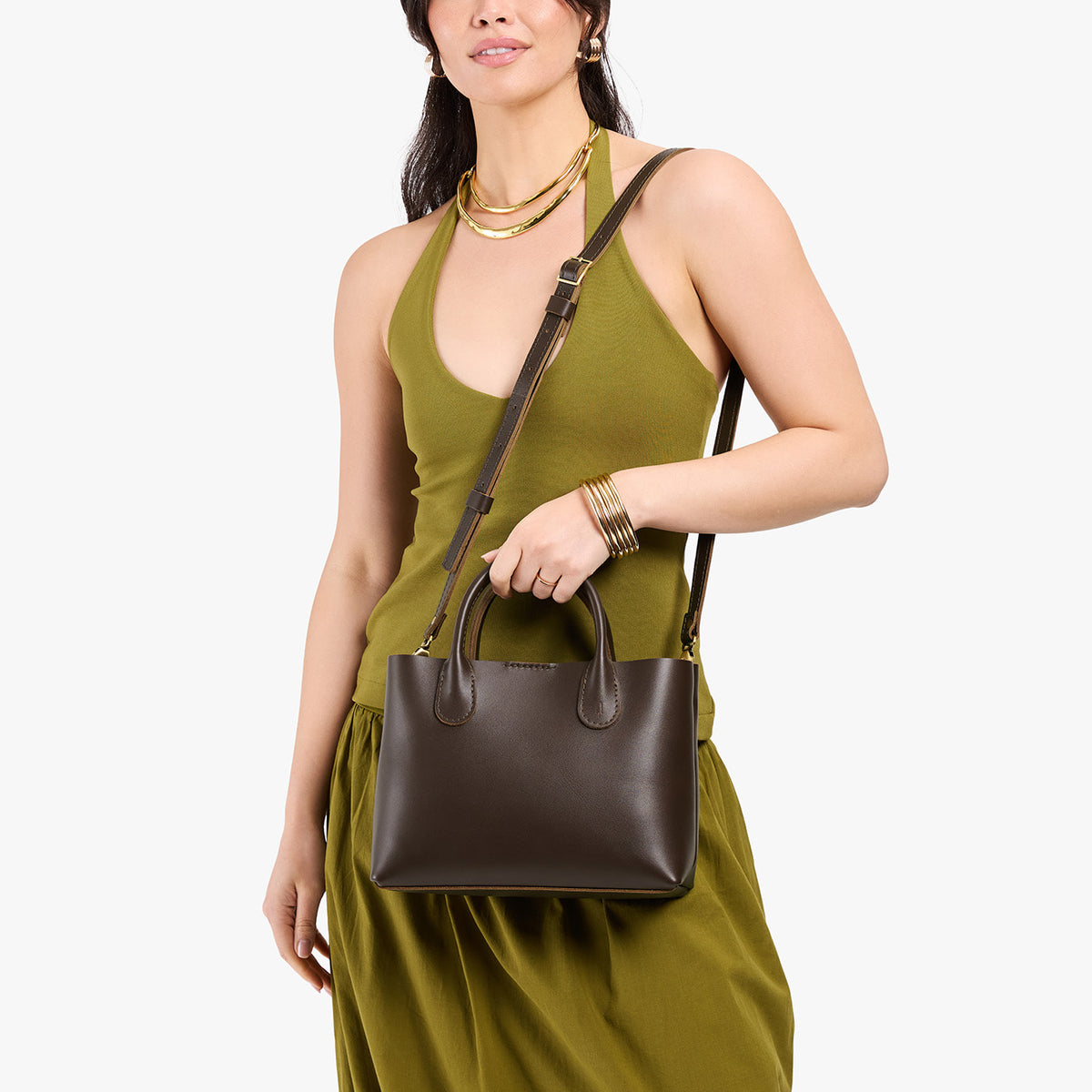 Grizzly*Large | Model holding mid-size tote purse with  structured leather handles and crossbody strap