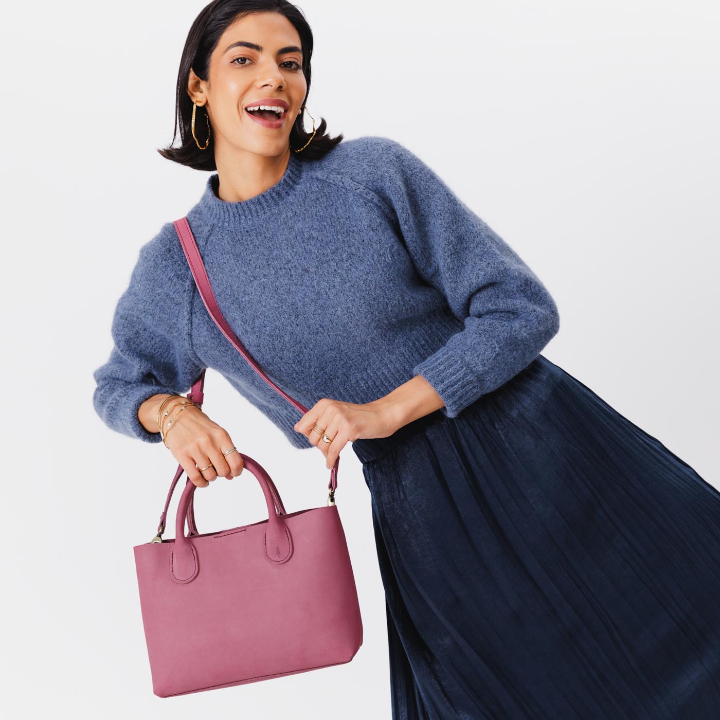 Foxglove*Large | Model holding mid-size tote purse with  structured leather handles and crossbody strap