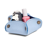 Skyway | Star-shaped foldable leather tray with snap-button corners holding nail polish and car keys