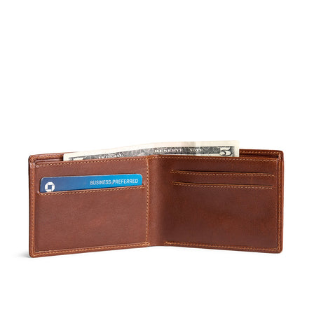 Saddlestone | Bifold leather wallet with card slots open with card and cash inside