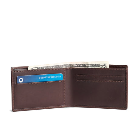 Trailstone | Bifold leather wallet with card slots open with card and cash inside
