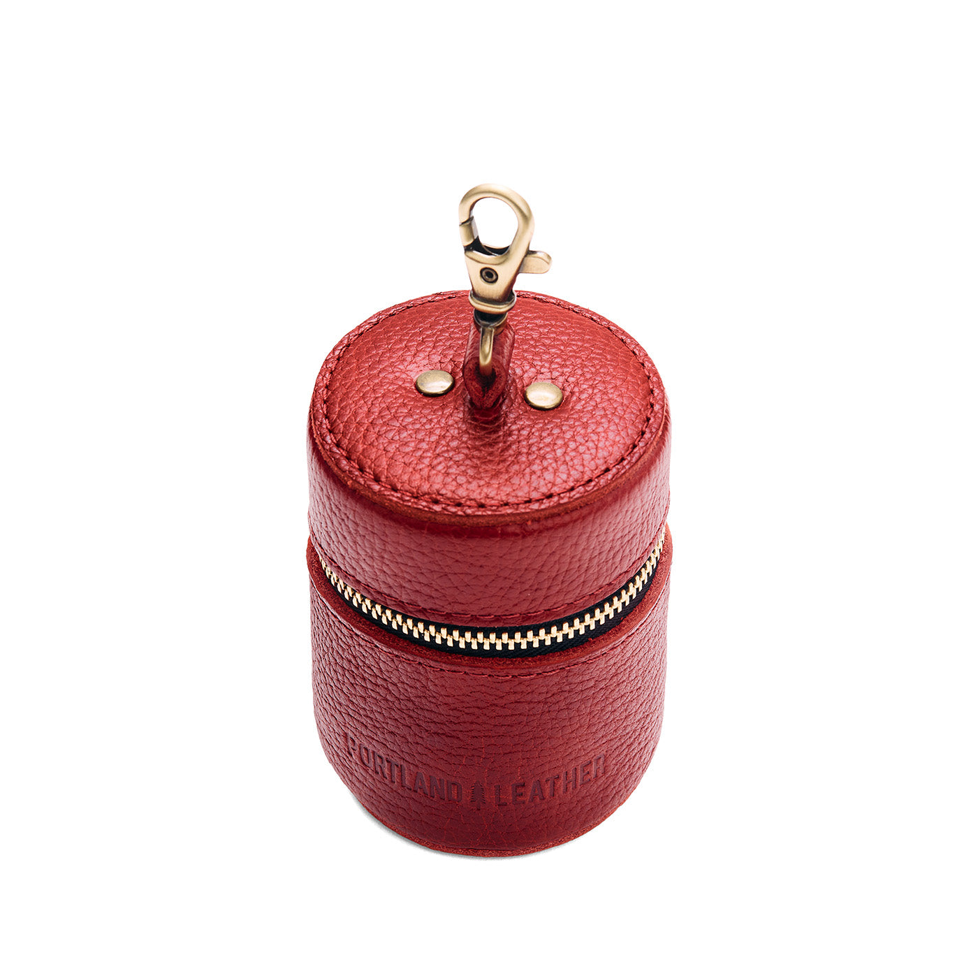 Chili Red | Cylindrical shaped pouch with a gold zipper and swivel lobster claw clasp