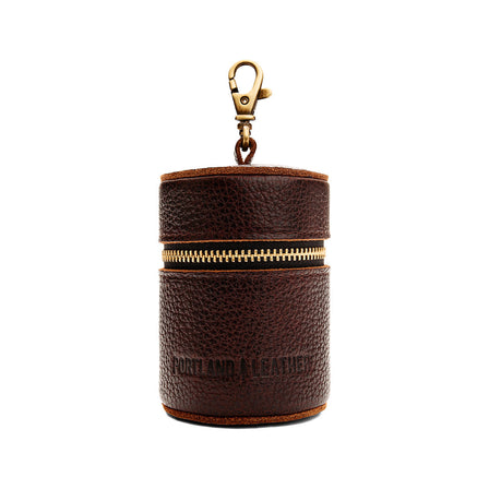 Coldbrew | Cylindrical shaped pouch with a gold zipper and swivel lobster claw clasp
