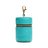 Seafoam | Cylindrical shaped pouch with a gold zipper and swivel lobster claw clasp