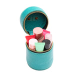 Seafoam | Cylindrical shaped pouch with a gold zipper and swivel lobster claw clasp