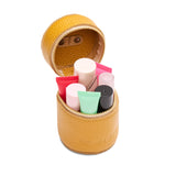 Sunshine | Cylindrical shaped pouch with a gold zipper and swivel lobster claw clasp