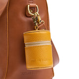 Sunshine | Cylindrical shaped pouch with a gold zipper and swivel lobster claw clasp on a bag