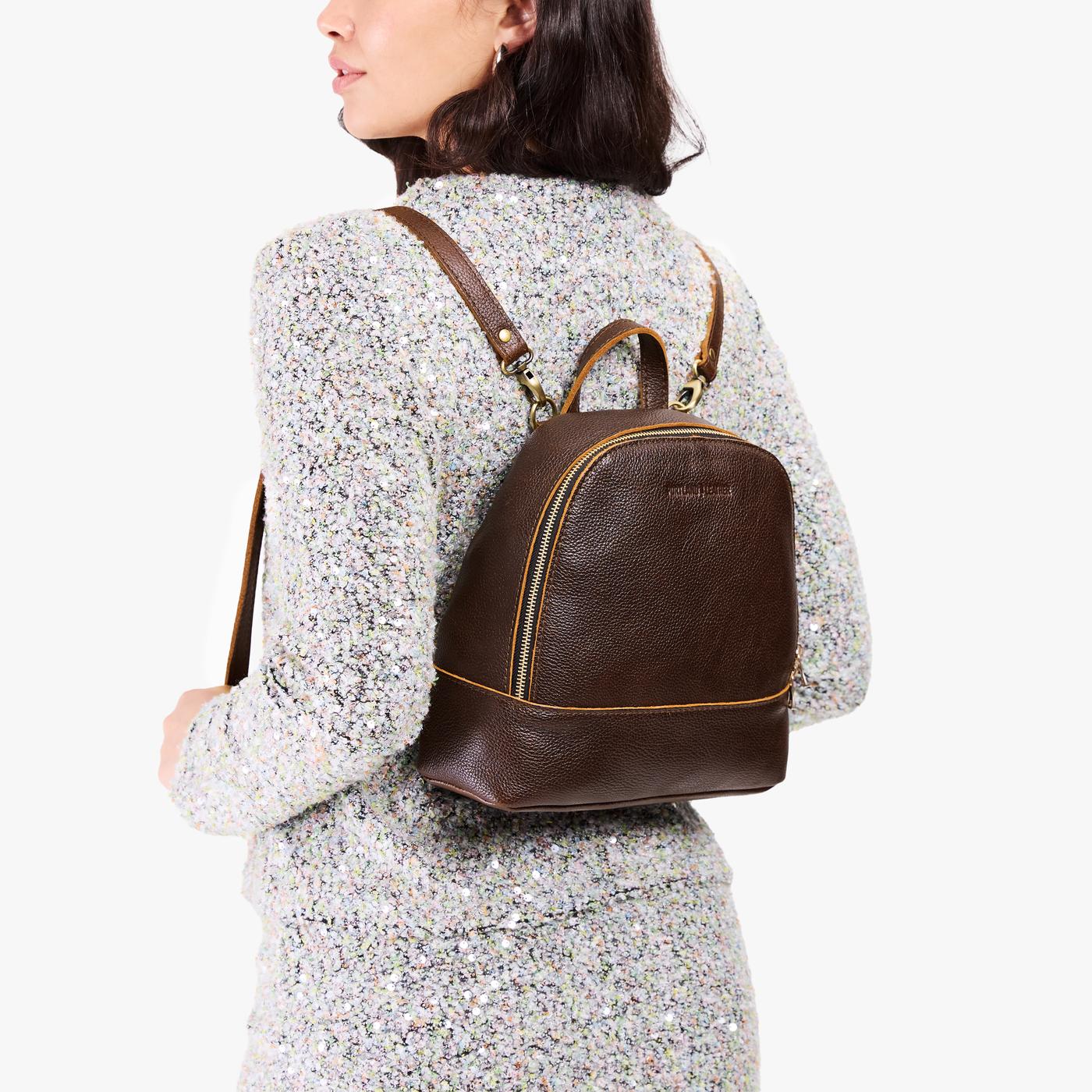 Coldbrew | Model wearing leather backpack with debossed Portland Leather logo on front
