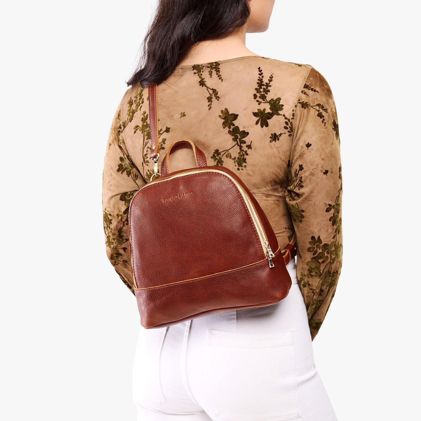 Nutmeg | Model wearing leather backpack sling bag style