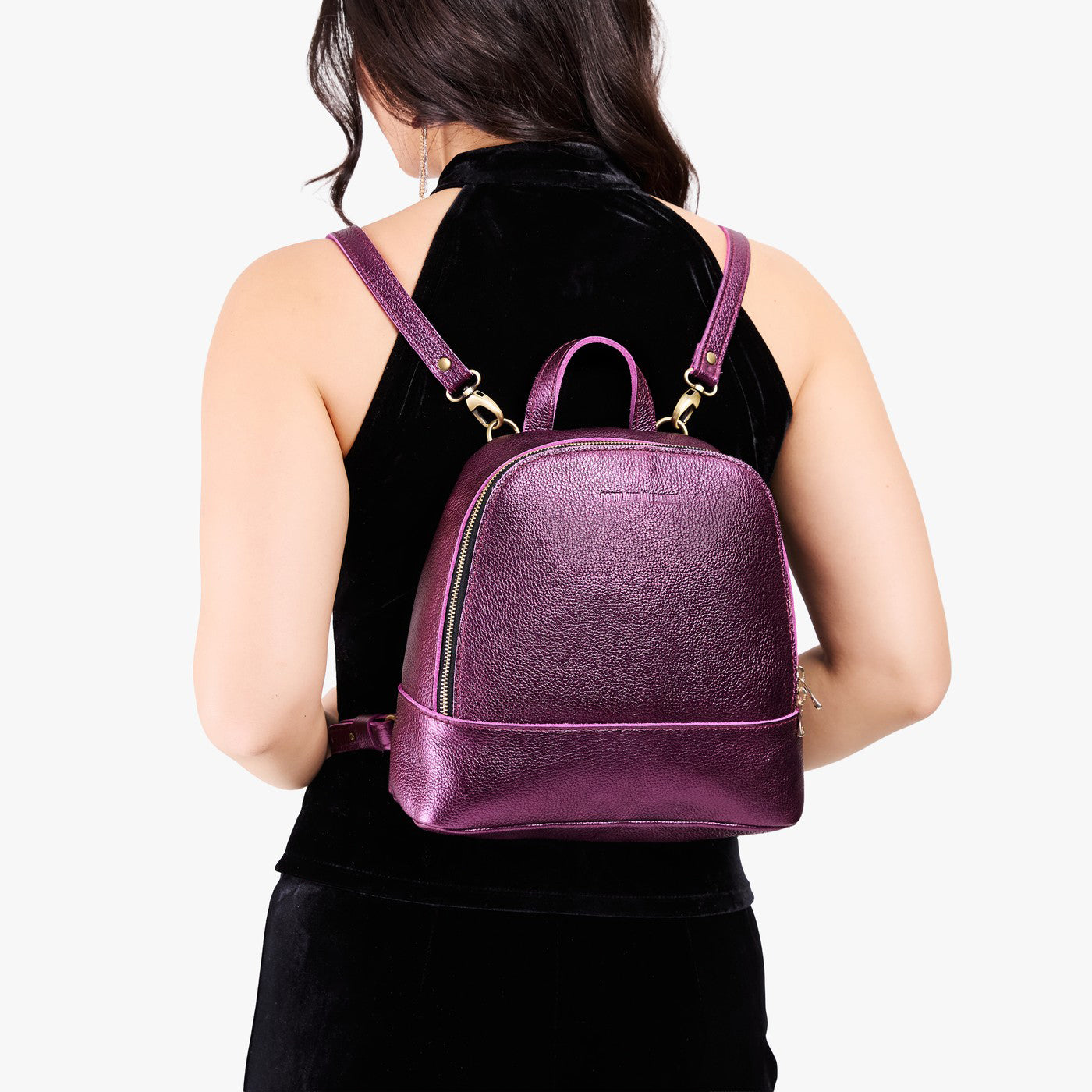Ultra Violet | Model wearing leather backpack with debossed Portland Leather logo on front