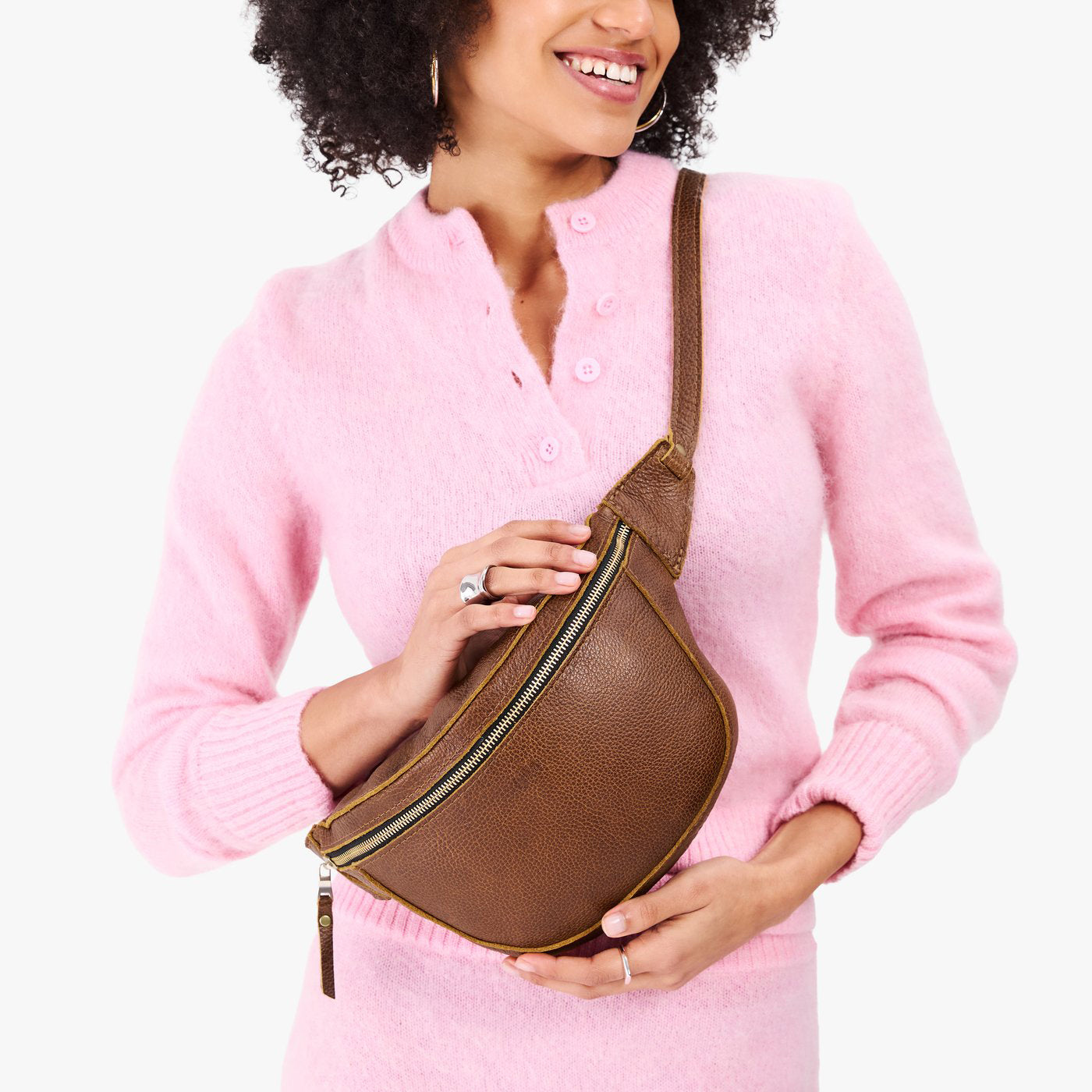 Asheville | Model wearing a sling bag with front zipper