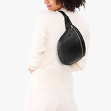 Black | Model wearing a sling bag with front zipper