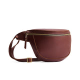 Cognac | Leather fanny pack shaped bag with a front zipper opening