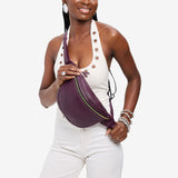 Plum | Model wearing a sling bag with front zipper