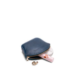 Caspian Small | Seashell shaped leather makeup bag with curved top zipper and flat bottom