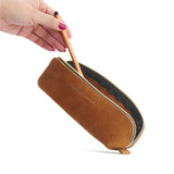 Jackson | Leather pouch with curved seams and top zipper