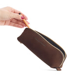 Stagecoach | Leather pouch with curved seams and top zipper