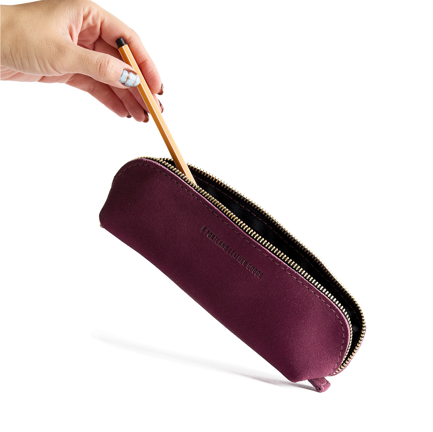 Superbloom | Leather pouch with curved seams and top zipper