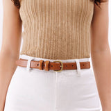 Amber | Amber slim double loop leather belt on model's waist