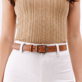 Amber | Slim double stitched leather belt on woman's waist
