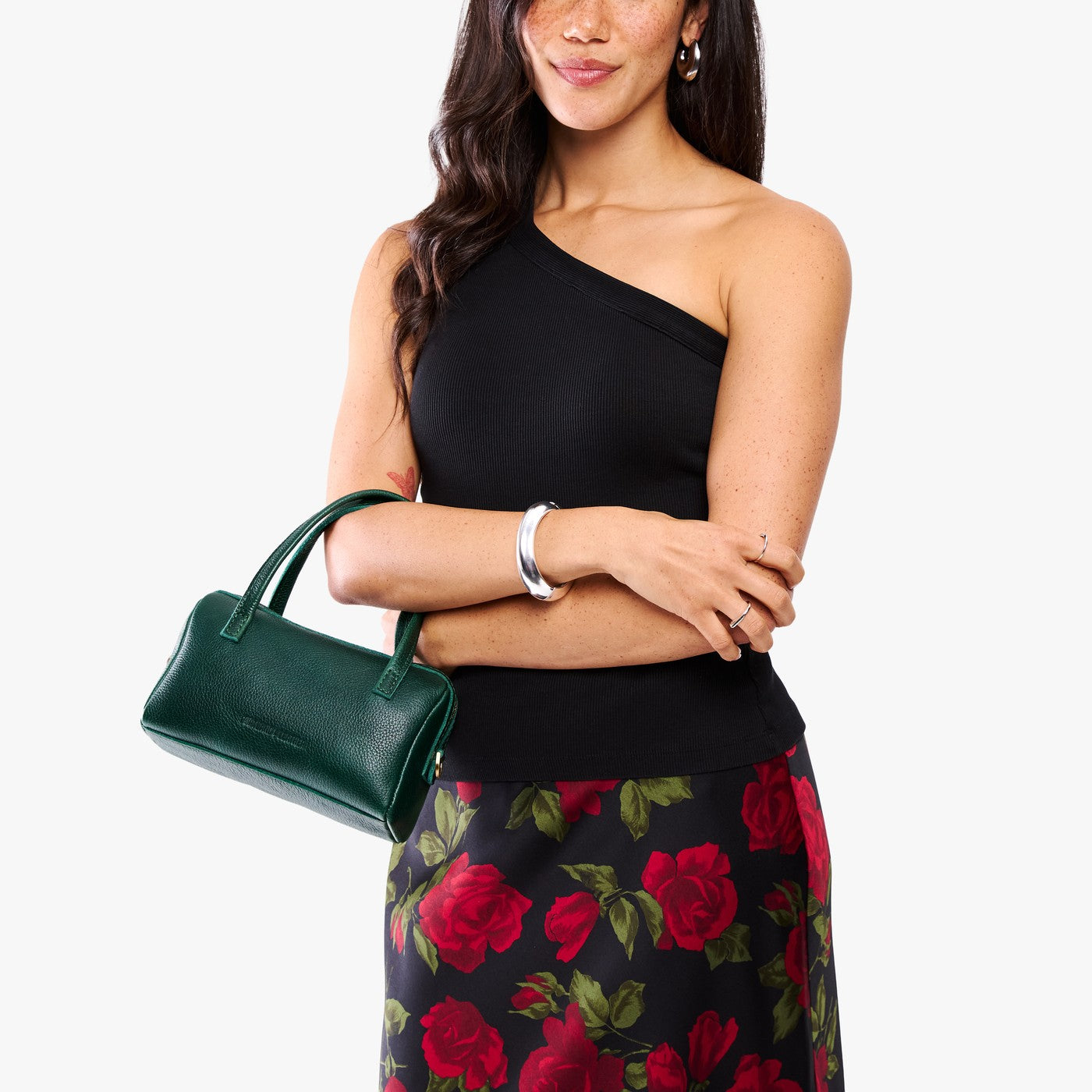 Forest Green*Small | Model holding mini duffle shaped handbag with crossbody strap