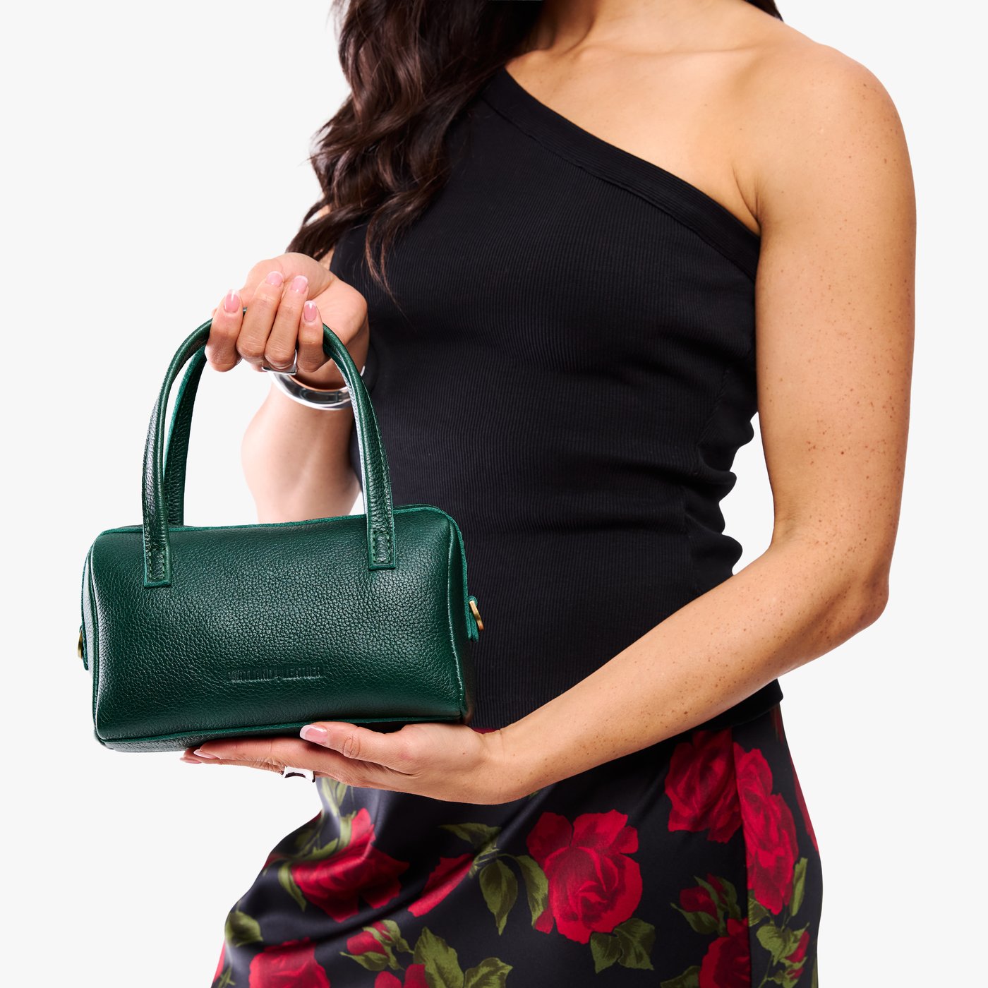 Forest Green*Small | Model holding mini duffle shaped handbag with crossbody strap