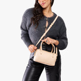 Moonflower Small | Model holding mini duffle shaped handbag with crossbody strap