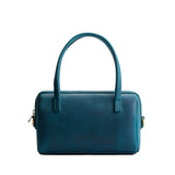 Westward Blue Small | Mini duffle shaped handbag with crossbody strap