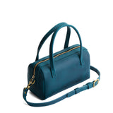 Westward Blue Small | Mini duffle shaped handbag with crossbody strap
