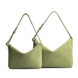 Laurel | Size comparison shot of small and large slouchy shoulder bags with zipper opening and three metal tree emblems
