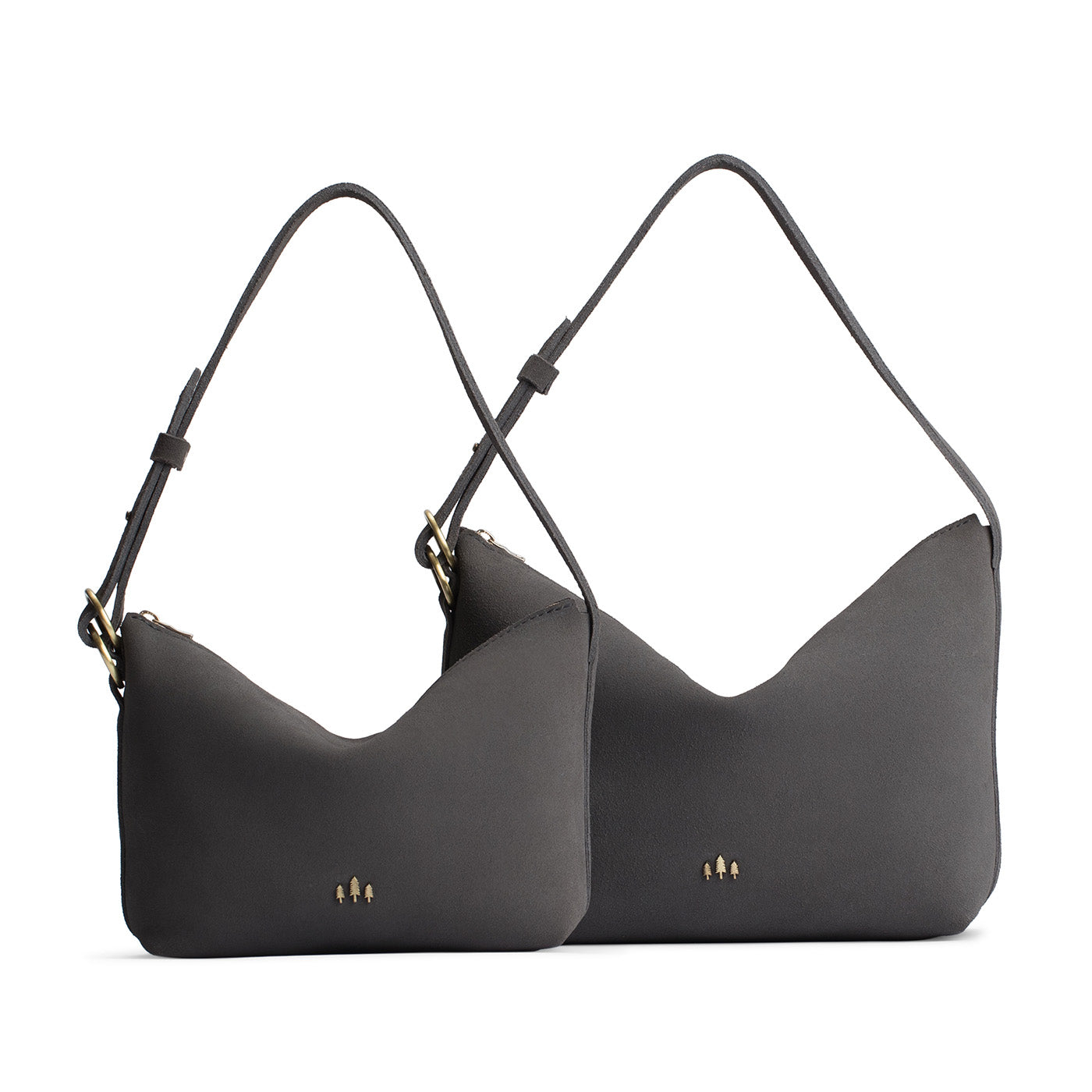 Smoke Grey | Size comparison shot of small and large slouchy leather shoulder bags with zipper opening and three metal tree emblems