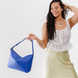 Astro Blue Large | Medium sized slouchy leather shoulder bag with zipper opening and three metal tree emblems