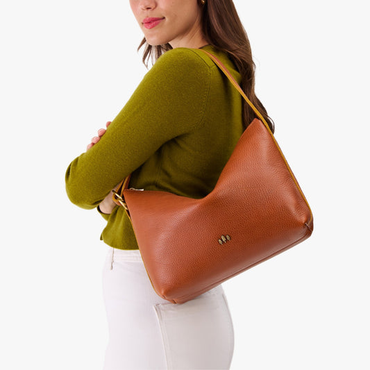 Sienna*Large | Medium sized slouchy leather shoulder bag with zipper opening and three metal tree emblems