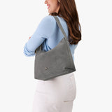 Smoke Grey Large | Medium sized slouchy leather shoulder bag with zipper opening and three metal tree emblems