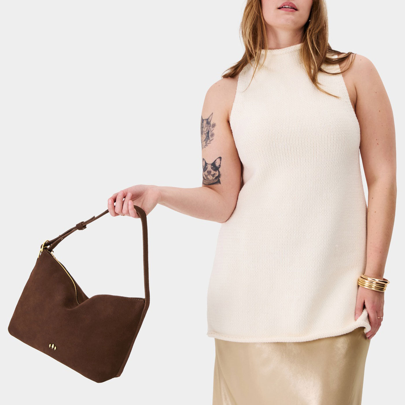 Stagecoach*Large | Medium sized slouchy leather shoulder bag with zipper opening and three metal tree emblems