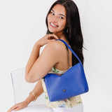 Astro Blue Small | Petite slouchy leather shoulder bag with zipper opening and three metal tree emblems