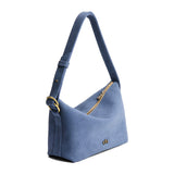 Denim Small | Slouchy Shoulder Bag that has a zipper opening and three metal tree emblems on a white background