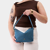 Mariner Blue Small | Petite slouchy leather shoulder bag with zipper opening and three metal tree emblems