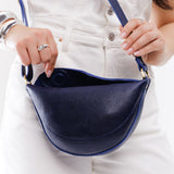Cobalt Small | Model wearing petite half circle shaped sling bag