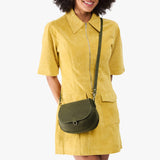 Old Growth Small | Model wearing a leather Crossbody with a flap and magnetic closure
