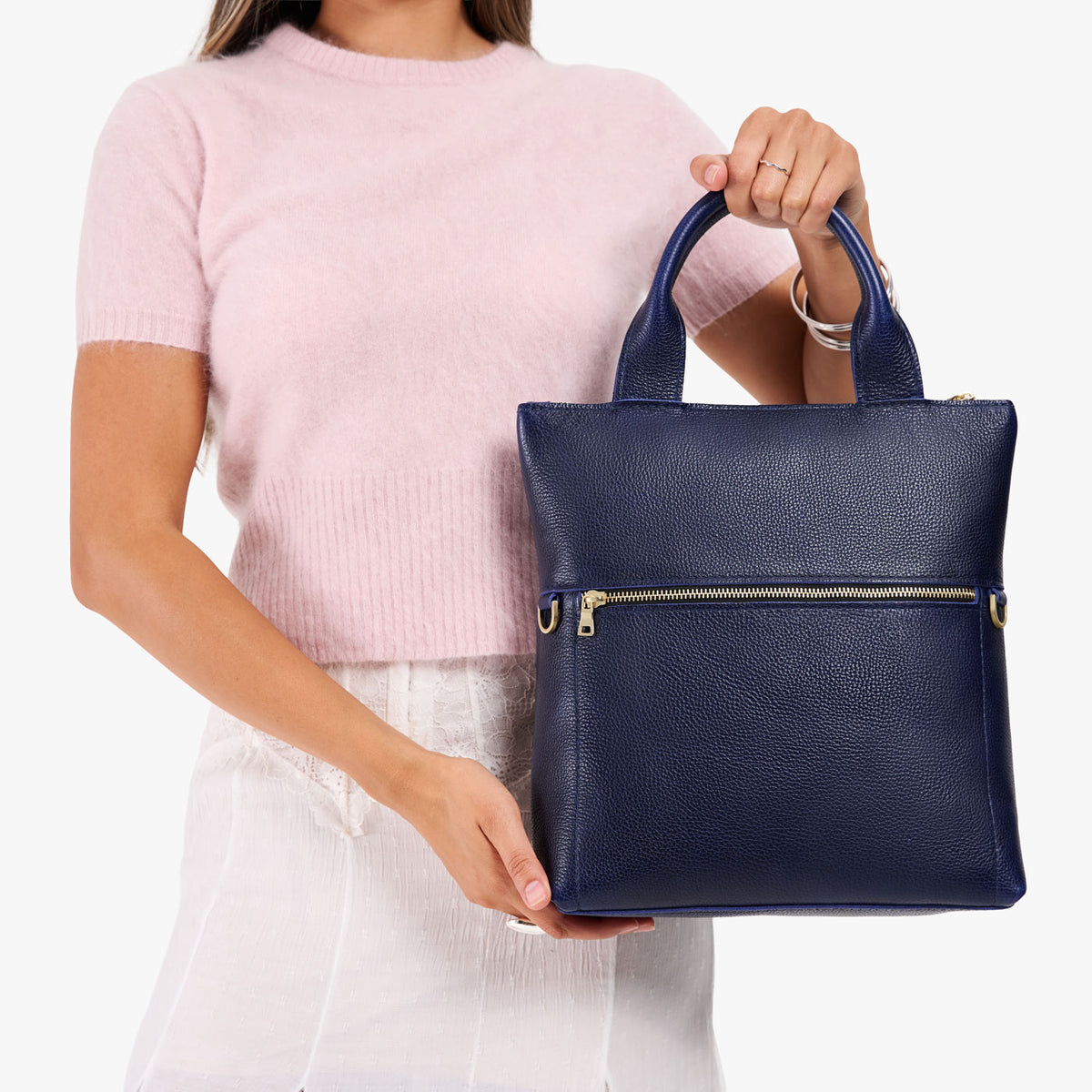 Cobalt*Small | Model wearing a convertible tote clutch crossbody