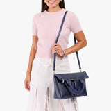 Cobalt Small | Model wearing a convertible tote clutch crossbody
