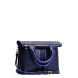 Cobalt Small | Convertible tote clutch crossbody with two large front pocket and top carry handles folded into a clutch