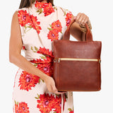 Nutmeg Small | Model wearing a convertible tote clutch crossbody
