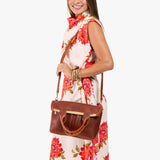 Nutmeg Small | Model wearing a convertible tote clutch crossbody