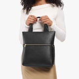 Pebbled--black Small | Model wearing a convertible tote clutch crossbody