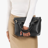 Pebbled--black Small | Model wearing a convertible tote clutch crossbody