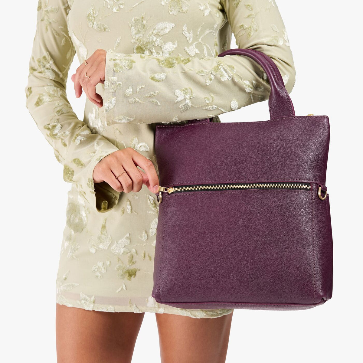 Plum*Small | Model wearing a convertible tote clutch crossbody